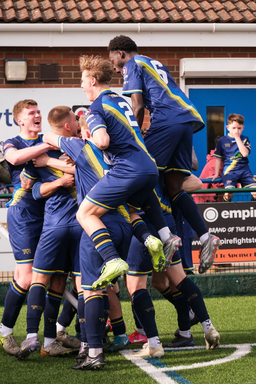 Bottesford Town players celebrating together at Birch Park